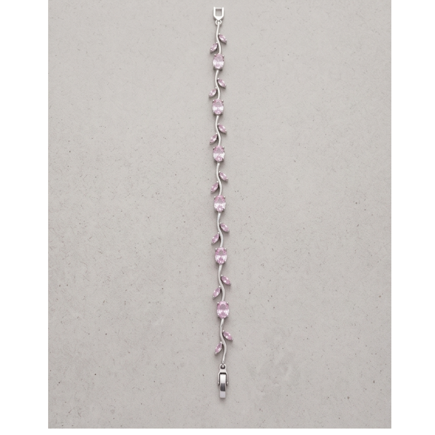 Silver bracelet with pink gemstones on a gray background